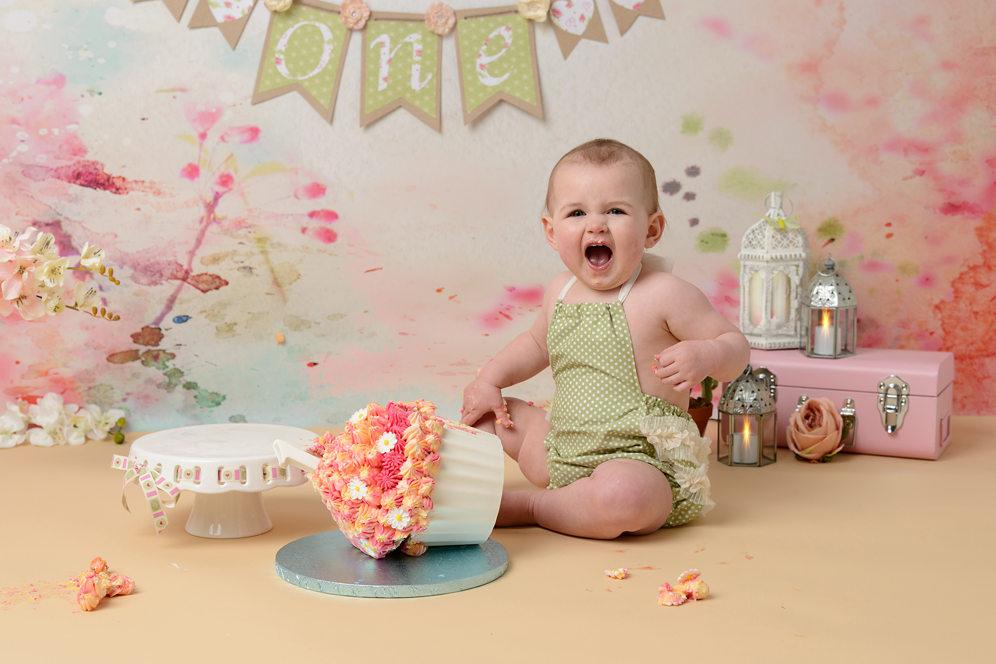 baby girl in a cake smash photoshoot by photographer in Hampshire